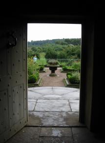 view of the manor garden from the kitchen doorway