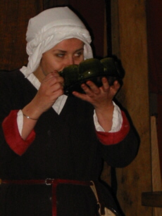Gill demonstrating a 15th Century drinking game
