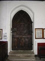 the heavy door of the church